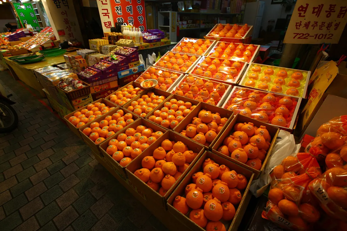 Fruit displays inside Dongmun Traditional Market in Jeju for market shopping