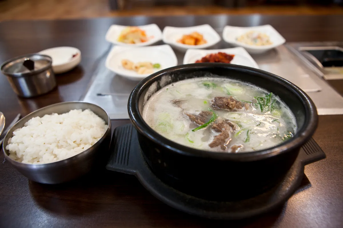 Galbitang beef short rib soup served with rice and side dishes for a Korean soup guide