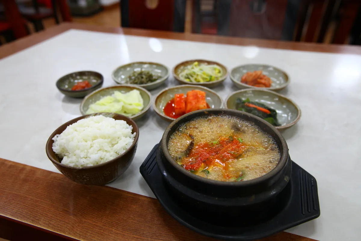 Doenjang jjigae soybean paste stew with rice and side dishes for a Korean soup guide