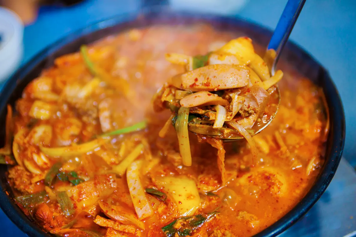Budae jjigae army stew with sausage and tofu for a Korean soup guide